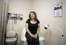 Woman in medical office with the help of ACCESS Community Health Program.