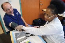 Man receiving medical advice with the help of the ACCESS Public Health Division.